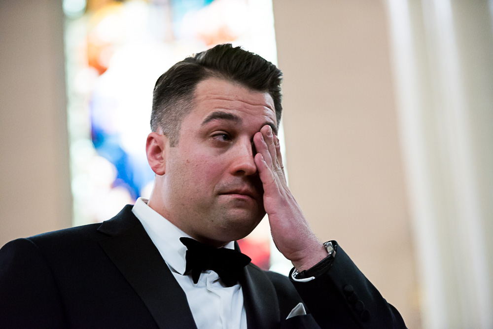 Emotional moment at the wedding, groom crying.